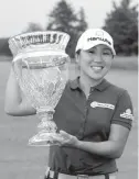  ?? Associated Press ?? In-Kyung Kim, of South Korea, holds the trophy after winning the ShopRite LPGA Classic golf tournament Sunday in Galloway Township, N.J.