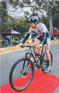  ?? Picture: Gina ?? Hobart’s Alex Hunt on his way to victory in the Freycinet Challenge. Richman