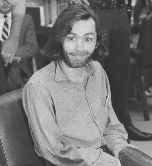  ?? GEORGE BRICH THE ASSOCIATED PRESS FILE PHOTO ?? Cult leader Charles Manson, who died in 2017, caused a commotion in a California courtroom by waving around a copy of the Los Angeles Times with a “Manson Guilty, Nixon Declares” headline.