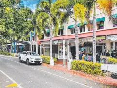  ??  ?? UP FOR GRABS: A mix of commercial tenancies on Macrossan St, Port Douglas (above), are being brought to the market early, as is the building (below), containing the Courthouse Hotel bottle shop on the corner of Davidson and Port streets in Port Douglas.