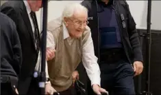  ?? Associated Press ?? Oskar Groening, a 93-year-old former guard and bookkeeper at Auschwitz, arrives for his trial in Lueneburg, Germany, on 300,000 counts of accessory to murder.