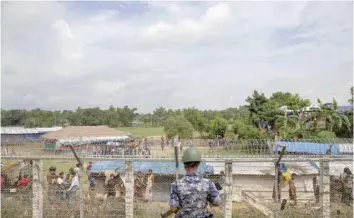  ?? — AFP ?? Myanmar border police patrol watching over Rohingya refugees settlement in the ‘no man’s land’ zone between Myanmar and Bangladesh border.