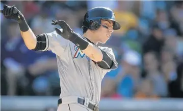  ?? DAVID ZALUBOWSKI/AP ?? Marlins left fielder Christian Yelich is striking out once every four at-bats, a high rate for a player expected to hit for average rather than power. His batting average only recently got up to .230.