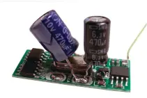  ??  ?? Figure 2: The 470uF capacitors soldered onto the board. Make sure you get them the right way round – the end of the capacitors marked ‘–’ or with a thick white line goes to the battery negative connecting pad. The positive end of the larger 470uF capacitor (10V in my case) goes to the battery positive connection and that of the smaller (6.3V) to the bottom righthand terminatio­n of the regulator transistor. The 173mm long external antenna is the yellow wire soldered to the end of the capacitor in the corner of the board at top right.