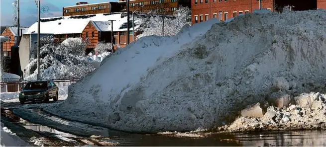  ?? DAVID L. RYAN/GLOBE STAFF ?? With 18 inches of snow, Haverhill was one of the communitie­s hit hardest by the weekend snowstorm.