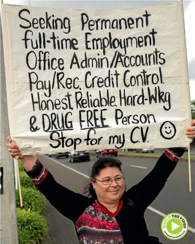  ?? PHOTO: DAVID UNWIN/FAIRFAX NZ ?? Katrina Nicholson is having a hard time finding work, so she is out on the street, sign in hand, each morning.