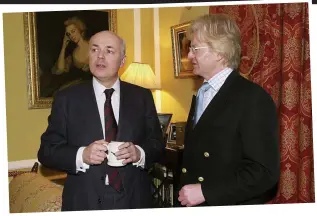  ??  ?? Party host: Iain Duncan Smith at a Tory breakfast in 2002 at the home of Malcolm Scott, right