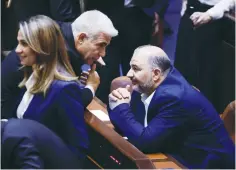  ?? (Olivier Fitoussi/Flash90) ?? FOREIGN MINISTER Yair Lapid speaks with Ra’am Party leader Mansour Abbas in the Knesset last month.