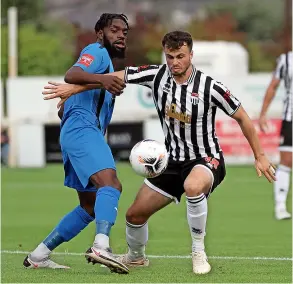  ?? ?? City’s James Morton battles for the ball