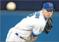  ?? CP PHOTO ?? Toronto Blue Jays pitcher Roy Halladay throws during a game in Toronto on April, 2003.