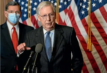  ?? AP ?? Senate Majority Leader Mitch McConnell, of Kentucky, speaks during a news conference with other Senate Republican­s on Capitol Hill in Washington yesterday. Senator John Barrasso, of Wyoming, listens at left.