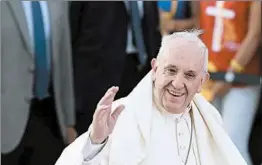  ??  ?? Pope Francis greets the faithful upon arrival to the airport in Santiago, Chile, on Monday.