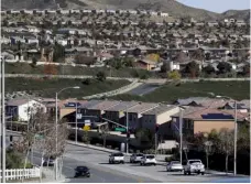  ?? This 2018 file photo shows homes stacked up on a hillside in Santa Clarita. ?? AP Photo/Marcio Jose Sanchez