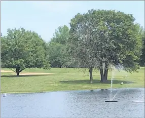  ?? RICK PECK/SPECIAL TO MCDONALD COUNTY PRESS ?? No. 16 at the Cassville Golf Club requires a drive over a lake, but if you go straight at the green several trees may be in the way for your approach.