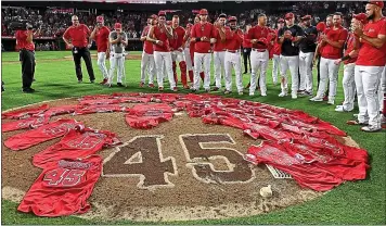  ?? KEITH BIRMINGHAM – SOUTHERN CALIFORNIA NEWS GROUP ?? The Angels placed their jerseys on the mound after Friday night’s victory in honor of late teammate Tyler Skaggs.