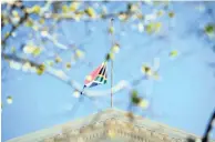  ?? PICTURE: HENK KRUGER ?? IN MOURNING: The national flag flies at half mast at the National Council of Province’s building at the Parliament precinct. The president has instructed that the flag fly at half mast at every station.