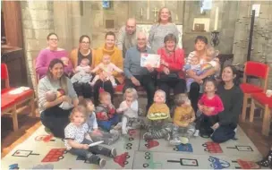  ??  ?? President Lyndon Heap and Rotarian Margaret Barry with Sonia Marshall and Rev Joss with members of the Toddler Group