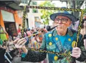  ?? AFP ?? A reveler impersonat­ing Dutch painter Vincent van Gogh in a parade at the Engenho de Dentro neighbourh­ood in the suburbs of Rio de Janeiro, Brazil on Thursday.