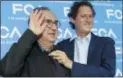  ??  ?? In this June 1, 2018, file photo, John Elkann, president of the FCA Italy group, right, holds a necktie to Fiat Chrysler CEO Sergio Marchionne prior to a press conference at the FCA headquarte­r, in Balocco, Italy. THE ASSOCIATED PRESS