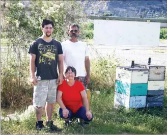  ?? SUSAN McIVER/Special to the Herald ?? Lorne and Char Newby and son Killian, above, moved from Alberta to Keremeos where they operate Deep Creek Honey Company.