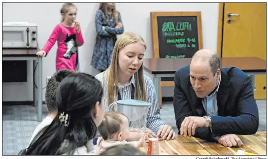  ?? Czarek Sokolowski The Associated Press ?? In Warsaw, Poland, Britain’s Prince William on Wednesday visits a refugee center for Ukrainians who have fled the war.