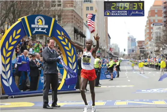  ?? | STEVEN SENNE/ AP ?? Kenyan Geoffrey Kirui earned $ 150,000 for winning the Boston Marathon. Galen Rupp took second, one of six Americans to finish in the top 10.