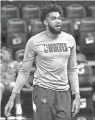  ?? DAVID BERDING/USA TODAY SPORTS ?? The Timberwolv­es, who have the No. 1 pick in Wednesday’s draft, are building around 2015 No. 1 pick Karl-Anthony Towns, above, and D’Angelo Russell.