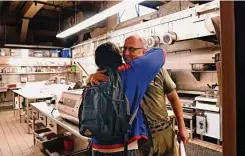  ?? ?? Owner Bruce Hill (right) parts with bartender Tim Abellera. After hanging on during the pandemic, the pizza joint closed this month.