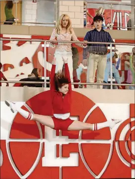  ?? FRED HAYES/DISNEY/TNS ?? Ashley Tisdale (top) in “High School Musical”
