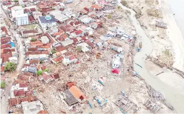  ?? — Reuters photo ?? An aerial view of an affected area after a tsunami hit Sunda strait at Sumur village in Pandeglang, Banten province, Indonesia in this photo taken by Antara Foto.