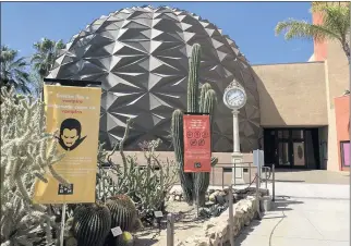  ?? FIELDING BUCK — STAFF ?? Banners with COVID-19 safety advice such as “how to sneeze like a vampire” decorate the entrance to the San Bernardino County Museum, which is open 11 a.m.-4 p.m. Tuesdays-Sundays.