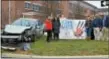  ?? SUBMITTED PHOTO ?? Henderson High School students stand next to the twisted wreckage of a Toyota Prius, which is part of 3D Collision Centers STOP Distracted Driving campaign. Front row: Abigail Williams (left), Laura Wilson, Jessica Gonzalez, Henderson High School...