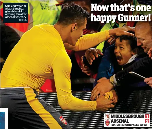  ?? REUTERS ?? Grin and wear it: Alexis Sanchez gives his shirt to a young fan after Arsenal’s victory