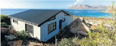  ?? Pictures: Mark Cullinan ?? This home in Glencairn, Cape Town, is an example of the increasing use of shipping containers for middle-class housing in SA.