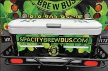  ??  ?? At left, the Spa City Brew Bus has a cooler in the back for passenger purchases collected along the tours. Below, signage welcomes passengers on the Spa City Brew Bus.