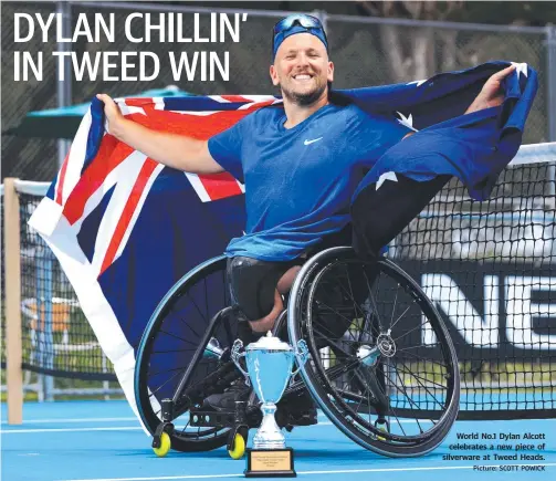  ?? Picture: SCOTT POWICK ?? World No.1 Dylan Alcott celebrates a new piece of silverware at Tweed Heads.