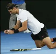  ?? AARON FAVILA — THE ASSOCIATED PRESS ?? Rafael Nadal falls to the court as he celebrates after defeating Bulgaria’s Grigor Dimitrov in the semifinals of the Australian Open on Saturday.