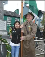  ??  ?? Caraíosa and Connie Foley pictured with the tricolour at the Easter Commemorat­ion in Millstreet.