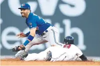  ?? MADDIE MEYER/GETTY IMAGES ?? Red Sox baserunner Jackie Bradley Jr. swipes second before Blue Jay Devon Travis can make a play in the third inning Thursday.