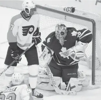  ?? VINCE TALOTTA/TORONTO STAR ?? Leafs goalie Jussi Rynnas takes a shot off the mask as Flyers’ Wayne Simmonds lurks Thursday night at ACC. Dougie Hamilton in the process.
“You can pick apart any piece of it. You can debate the Kessel trade. It’s not my job to sit here and assess,”...