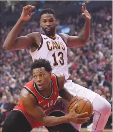  ?? Canadian Press photo ?? Toronto Raptors guard Kyle Lowry (7) controls the ball as Cleveland Cavaliers guard Rodney Hood defends during first half NBA basketball action in Toronto on Wednesday.
