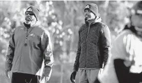  ?? AMY DAVIS/BALTIMORE SUN ?? Bowie State coach Damon Wilson, left, and offensive coordinato­r Tyrae Reid have led the Bulldogs to wins in their first 10 games this season.