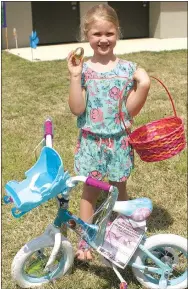  ?? Photo by Randy Moll ?? Juliet Smartt, 5, also won a new bicycle at Gentry’s Easter egg hunt.