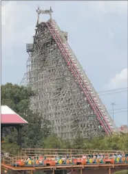  ?? LM OTERO/AP PHOTO ?? This July 20 photo shows the Texas Giant roller coaster at the Six Flags Over Texas park in Arlington, Texas. The death of a woman who fell 75 feet from the coaster is reinvigora­ting discussion among safety experts about whether it’s time to create...