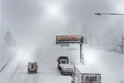  ?? Andy Barron/associated Press ?? A lone camper truck moves north on Interstate 80 at the Donner Pass Exit on Friday in Truckee, Calif. The most powerful Pacific storm of the season is forecast to bring up to 10 feet of snow into the Sierra Nevada by the weekend.