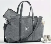  ?? POTTERY BARN KIDS ?? This Pottery Barn Kids’ designer diaper bag comes in herringbon­e. Other designs feature houndstoot­h, leather or vegan leather trims.