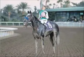  ?? Luis Sinco Los Angeles Times ?? JOCKEY MIKE SMITH takes a moment to reflect as he sits on Arrogate after winning the Breeders’ Cup Classic by a half-length over California Chrome.