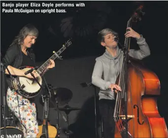  ??  ?? Banjo player Eliza Doyle performs with Paula McGuigan on upright bass.