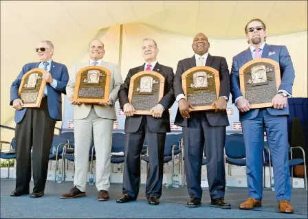  ?? ASSOCIATED PRESS ?? NEWLY-INDUCTED NATIONAL BASEBALL HALL OF FAMERS (FROM LEFT) Bud Selig, Ivan Rodriguez, John Schuerholz, Tim Raines Sr. and Jeff Bagwell hold their plaques after an induction ceremony at the Clark Sports Center on Sunday in Cooperstow­n, N.Y.