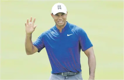  ?? Picture: AFP ?? ROARING. Tiger Woods made a good start to the World Golf Championsh­ips-Bridgeston­e Invitation­al at Firestone Country Club South Course on Thursday, shooting an opening-round 66.